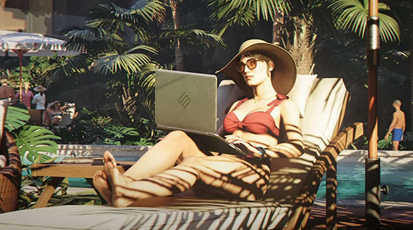 A woman in a red bikini and sun hat uses a laptop while reclining on a lounge chair by a tropical pool.