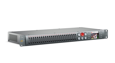 A long, silver rack-mounted electronic device with a row of vertical ports and a small digital display.
