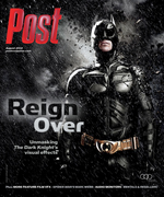 Batman in costume stands in the rain. Text on cover reads "Post Reign Over Unmasking The Dark Knight's visual effects".