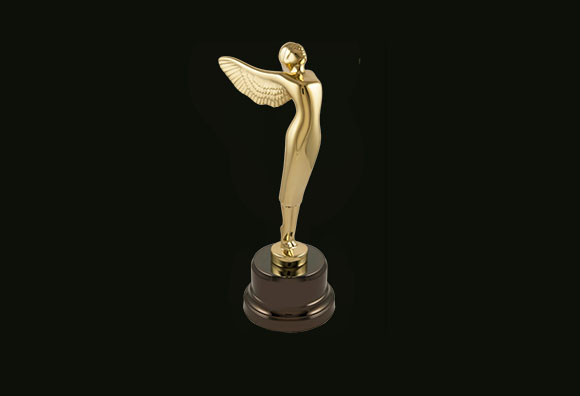A gold-colored trophy of a slender winged human figure standing on a dark circular base against a black background.