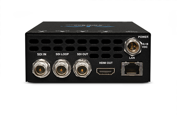 Rear view of a black electronic device showing SDI, HDMI, LAN, and power ports.