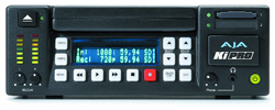 Front view of an AJA KiPRO video recorder with a blue digital display and various control buttons.