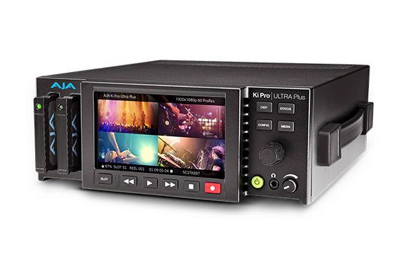 A black AJA Ki Pro Ultra Plus video recorder with a built-in screen and side-mounted media drives.