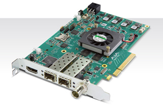 A green printed circuit board expansion card with a small black cooling fan and multiple output ports.