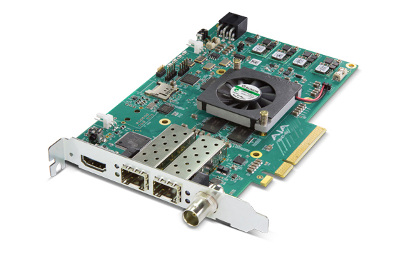 A green computer expansion card with a small black cooling fan and multiple metal connection ports.