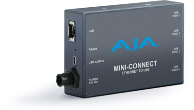 A dark gray AJA Mini-Connect rectangular device with various ports and labels on the front and side.