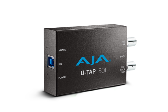 A black rectangular AJA U-TAP SDI device with a USB port and two silver SDI connectors.