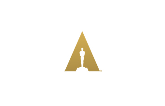 A gold triangle containing a white silhouette of a standing figure on a pedestal.