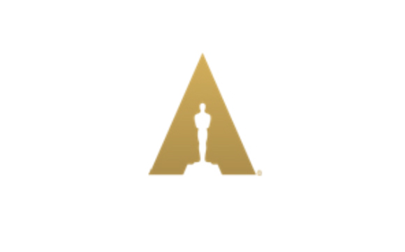 A gold triangle containing a silhouette of a standing award statue on a white background.