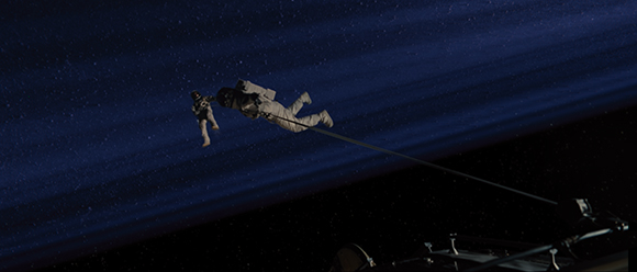 Two astronauts in white spacesuits float in dark space, tethered to a structure against a starry background.