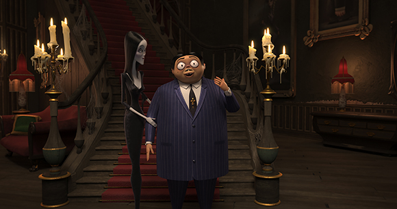 Animated tall, thin woman in black and a large man in a pinstripe suit stand in a dark, gothic mansion.