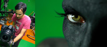A man in a pink shirt uses a professional camera in a green screen studio next to a close-up of a face with black makeup.