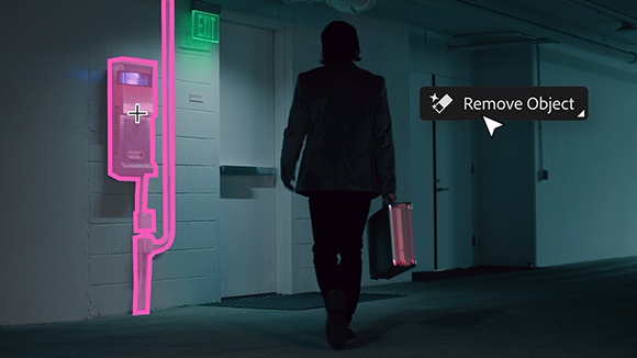A person walks down a dark hallway past an exit sign, with a digital interface highlighting a wall-mounted box.