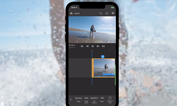 A smartphone screen showing a video editing interface with a clip of a person on a beach.