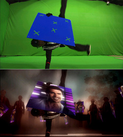 Split image showing a person holding a blue board against a green screen above a dark, stylized version.
