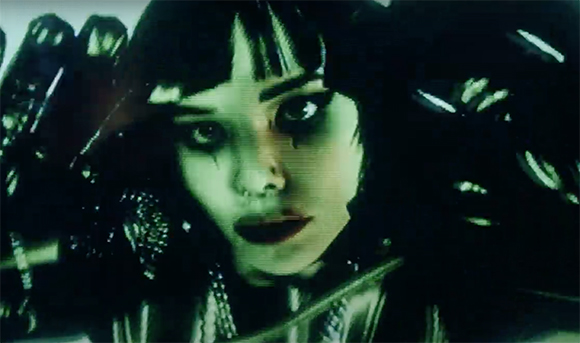 Close-up of a person with dark bangs and heavy eye makeup looking directly at the camera.