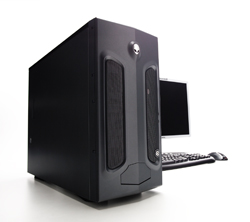 A large black desktop computer tower standing next to a monitor and keyboard on a white surface.