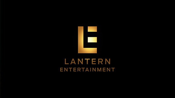 Gold stylized letter L and E logo above the text Lantern Entertainment on a black background.
