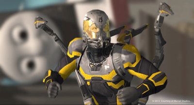A character wearing gray and yellow high-tech armor with a helmet and mechanical appendages.