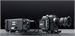 Two black professional cinema camera bodies with lenses and accessories on a dark background.