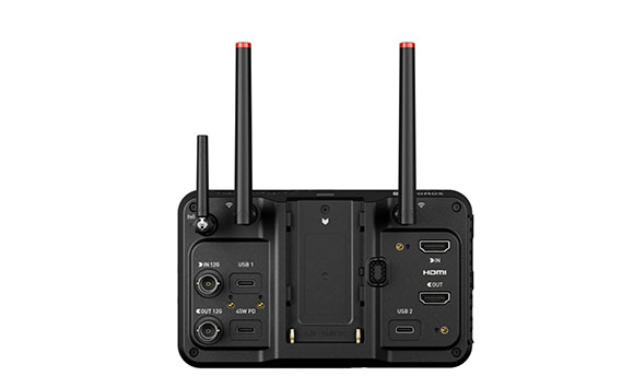 Rear view of a black electronic device with two long antennas and various input and output ports.