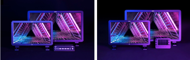 Two monitors and a small control pad displaying pink and blue neon geometric patterns.