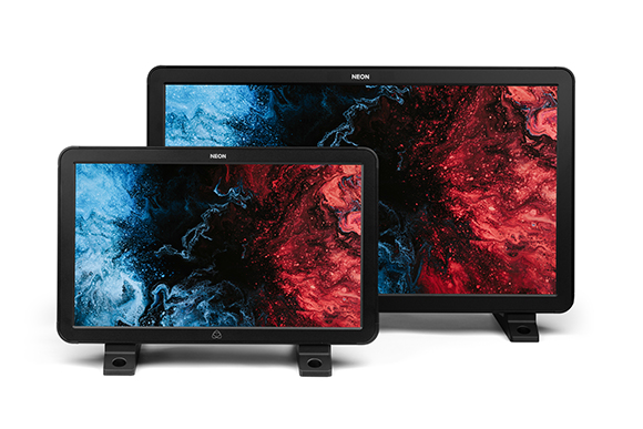 Two black computer monitors of different sizes displaying colorful abstract red and blue liquid patterns.