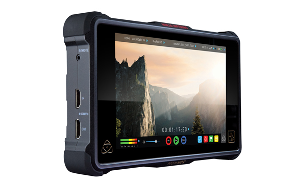 A rugged black video monitor displaying a scenic mountain landscape on its screen.