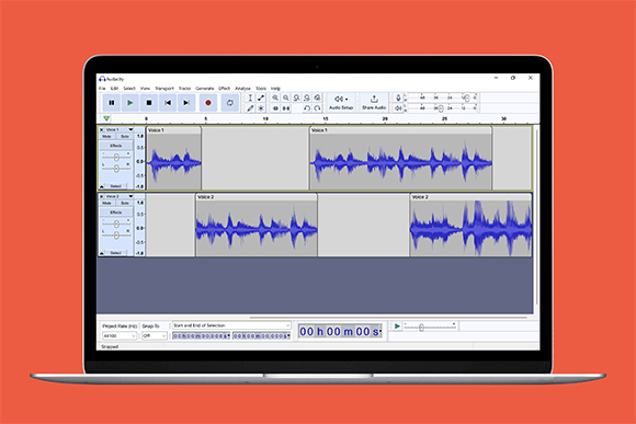 Laptop screen showing Audacity software with two blue audio waveform tracks on a red background.