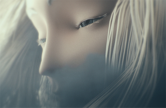 Close-up of a person's face with light blonde hair and eyes looking downward through a soft haze.