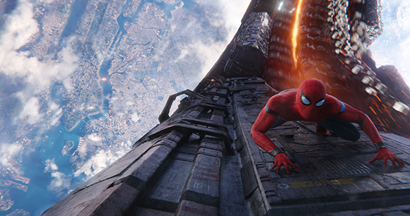 Spider-Man crawls up the side of a tall, metallic skyscraper overlooking a sprawling city below.