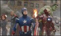 A group of superheroes, including Captain America, Iron Man, and Hulk, stand amidst smoke and rubble.