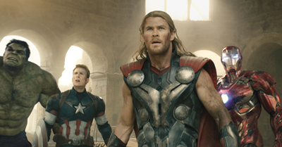 Thor, Captain America, Hulk, and Iron Man standing in a stone courtyard.
