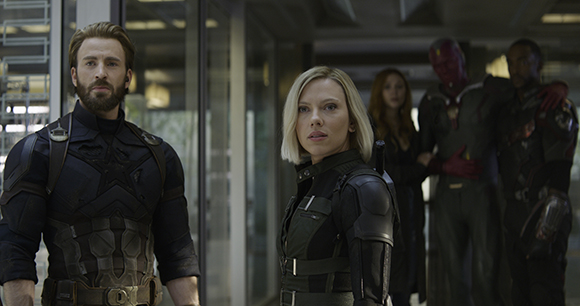 Captain America and Black Widow stand in the foreground with Vision, Scarlet Witch, and War Machine behind them.