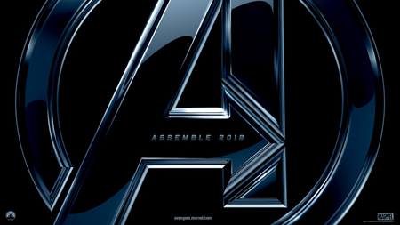 A metallic, blue-tinted Avengers 'A' logo on a black background with the text ASSEMBLE 2012.