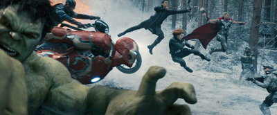 A group of superheroes charging through a snowy forest landscape.