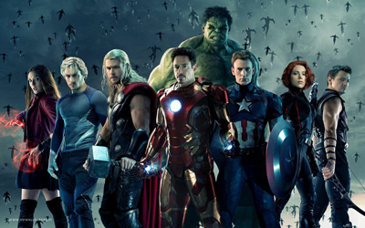 A group of superheroes standing in a line against a dark, cloudy sky filled with flying objects.