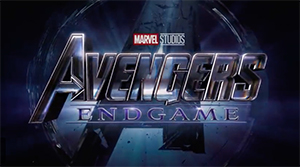 The Avengers Endgame logo in metallic silver lettering against a dark, swirling cosmic background.