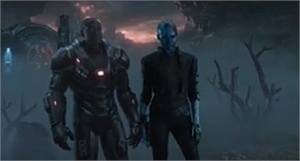 A large armored figure and a blue-skinned figure stand together in a dark, foggy environment.