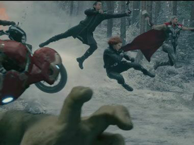 Several characters leap through a misty forest during a battle scene.