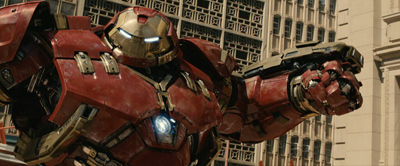 A large red and gold mechanical armored suit with glowing blue eyes and chest piece.