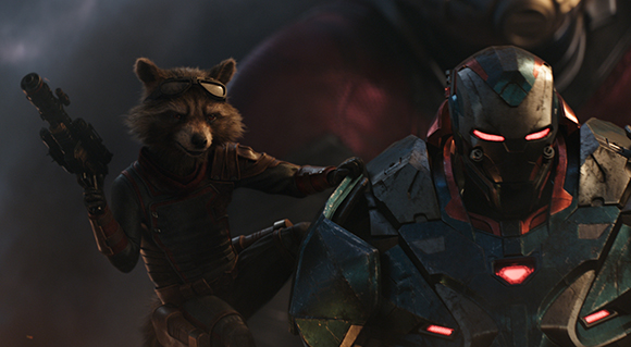 Rocket Raccoon holding a weapon next to War Machine in armored suits.