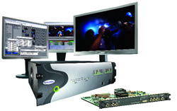 Three computer monitors displaying video editing software and footage next to a silver hardware server and circuit board.