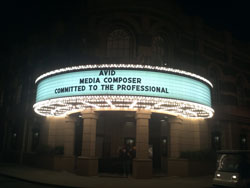 A theater marquee at night with lights, displaying "AVID MEDIA COMPOSER COMMITTED TO THE PROFESSIONAL."