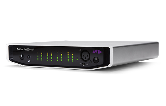 A silver Avid Artist | DNxIP audio interface with green LED level meters and various input ports on a black front panel.