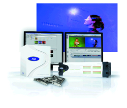Avid computer monitors, a white hardware tower, and a circuit board against a blue background.