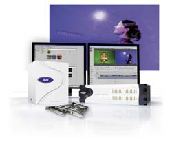 Computer monitors, a white tower case, and internal hardware components on a white surface.