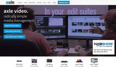 A person sits at a desk with two large monitors displaying video editing software and media files.