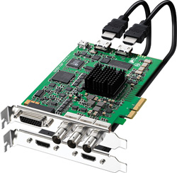 A green computer expansion card with a black heatsink and two black cables connected to the top.