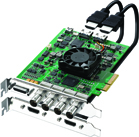 A green circuit board video capture card with a cooling fan and several black cables attached.
